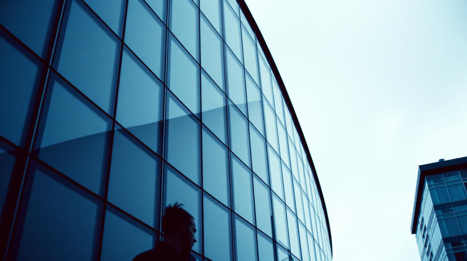 Sealed 1990s office building with mirrored glass facade
